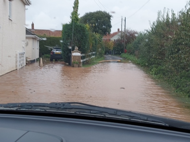 Flooding outside The Malt House, Perry Green
